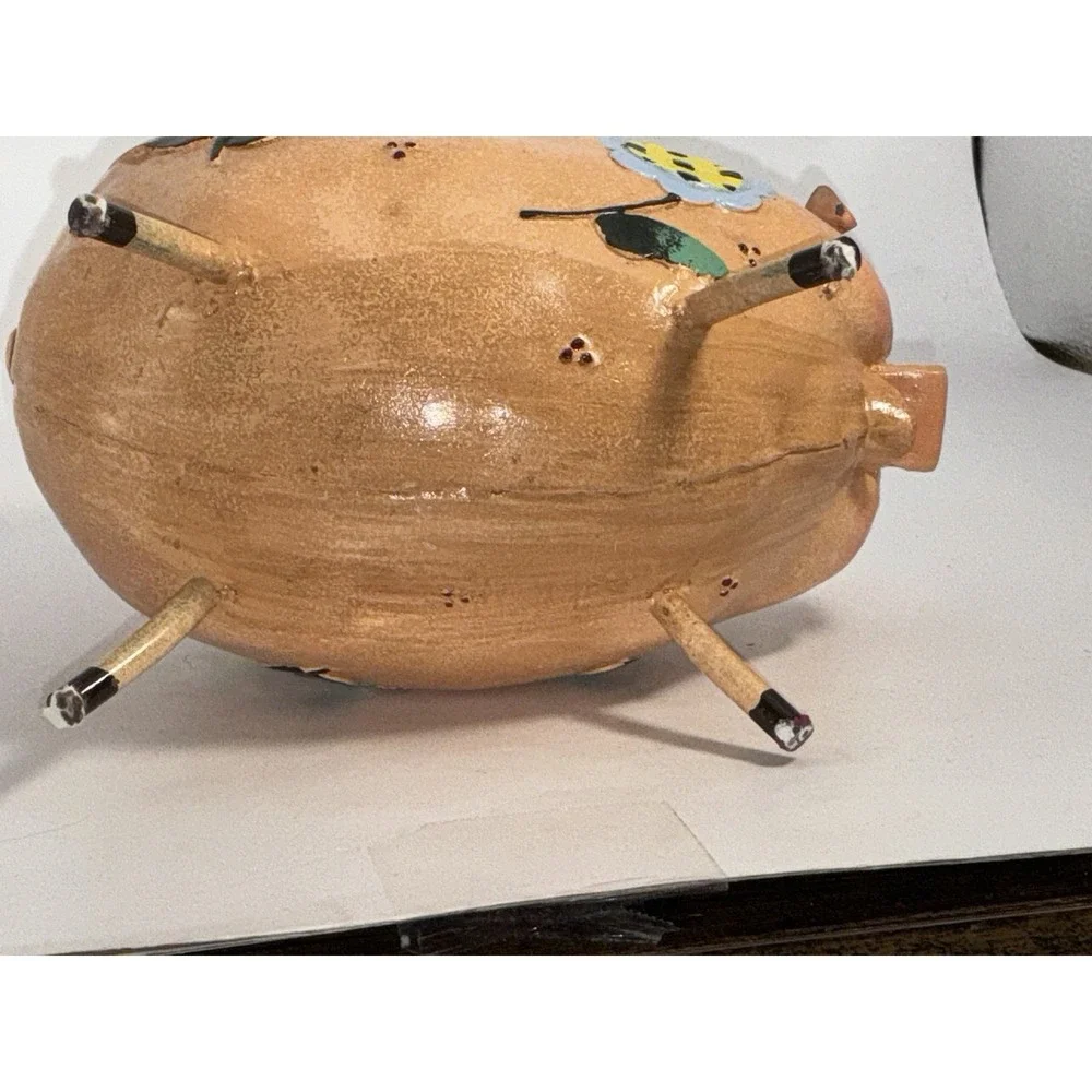 Floral Decorated Pig With Curly Tail And Cute Ears Made Of Metal?